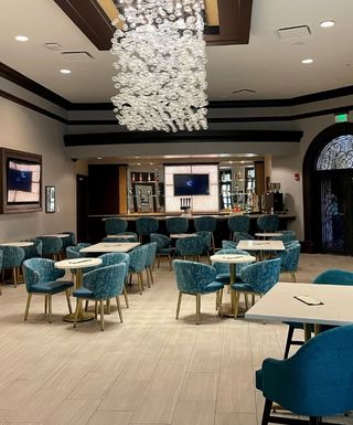 Parisi Coffee Room with tables, chair and bar