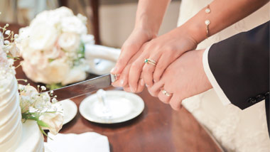 couple cutting wedding cake