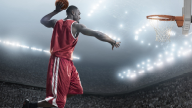 man dunking a basketball